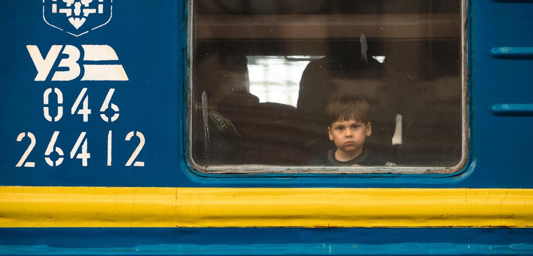 Boy looking out of the window of the train