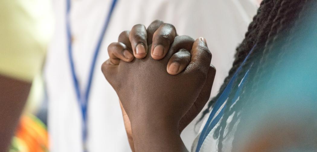 Praying hands, young girl