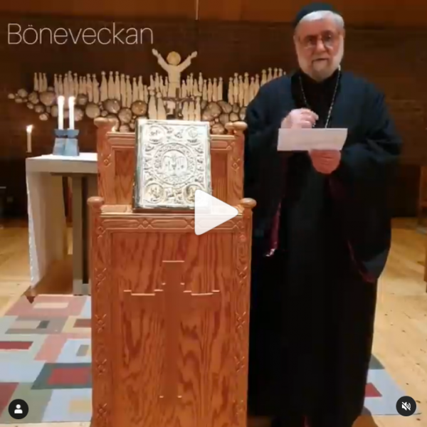 A prayer led by Father George Safar of St Dimet's Syrian Orthodox congregation