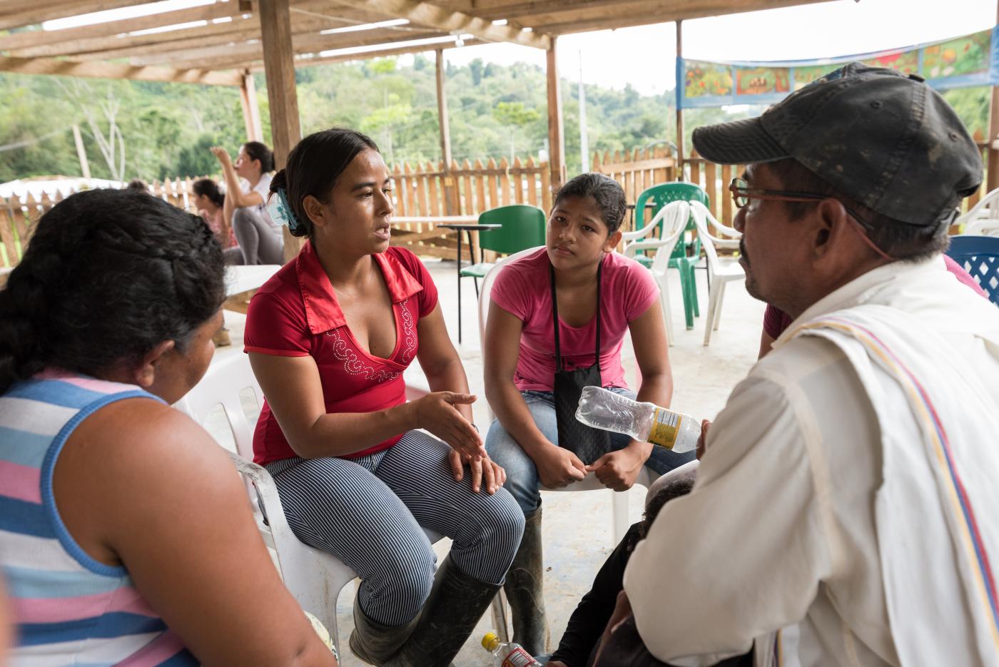 Woman leads conversation in rural Colombia