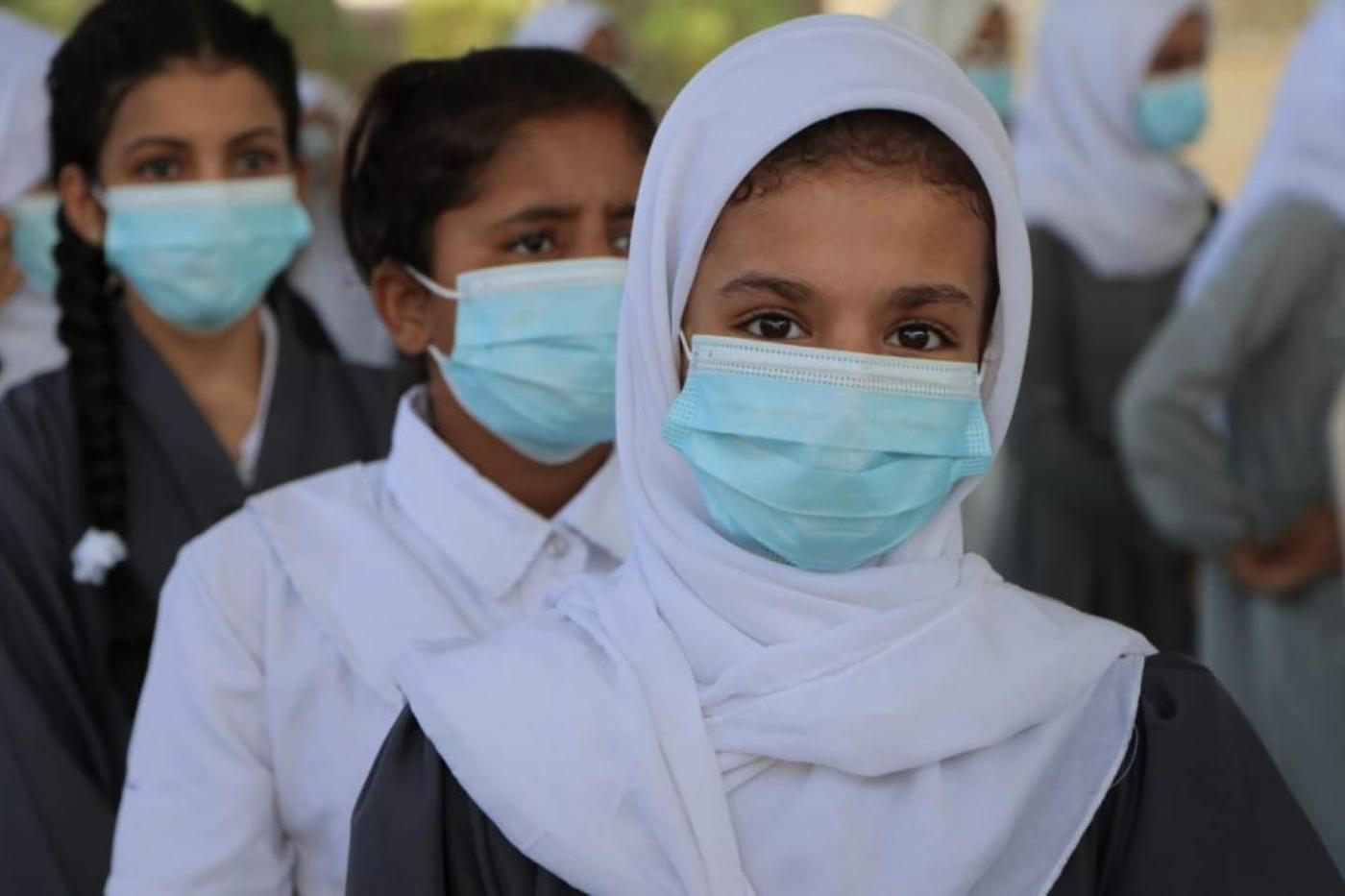 Girls in southern Yemen wearing face masks as they return to school following months of closure due to the COVID-19 pandemic.