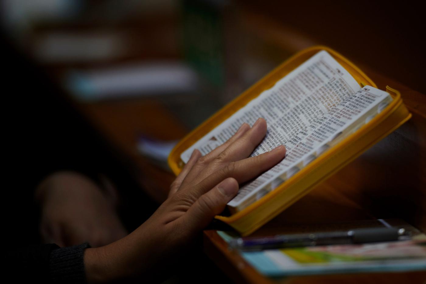 Woman reading Bible in Korean 