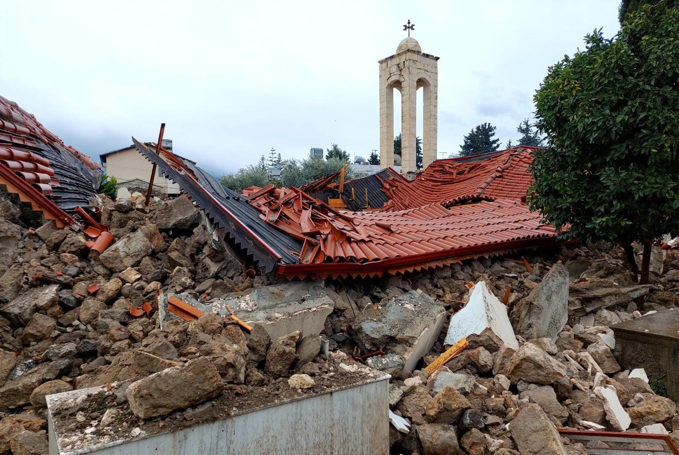 Church tower among ruins after the earthquake