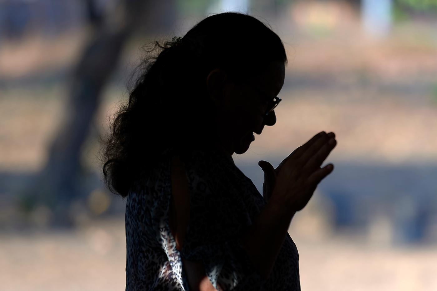 a woman prays 