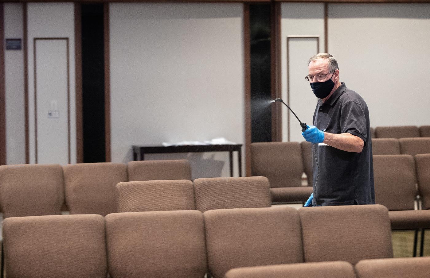 Parishioner sprays disinfectant between the services at Franklin (TN, United States) First United Methodist Church, which has adopted the safety protocols to help prevent the possible spread of COVID-19. Photo: Mike DuBose/UM News
