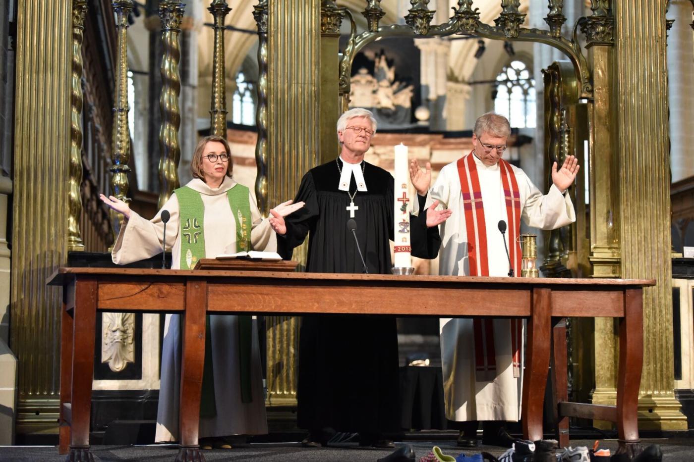 Rev. Margarithe Veen, Bishop Dr Heinrich Bedford-Strohm and Rev. Dr Olav Fykse Tveit in ecumenical prayer service at the Nieuwe Kerk in Amsterdam. Photo: Albin Hillert/WCC