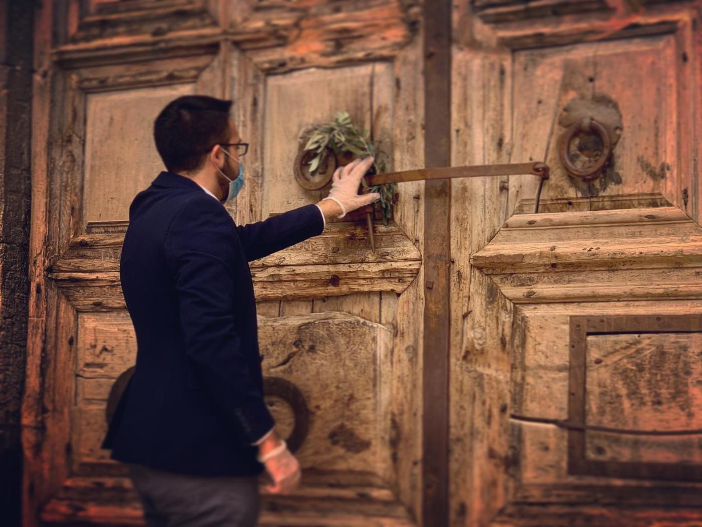 At the door of the Church of the Holy Sepulchre. Photo: courtesy of Rafi Ghattas