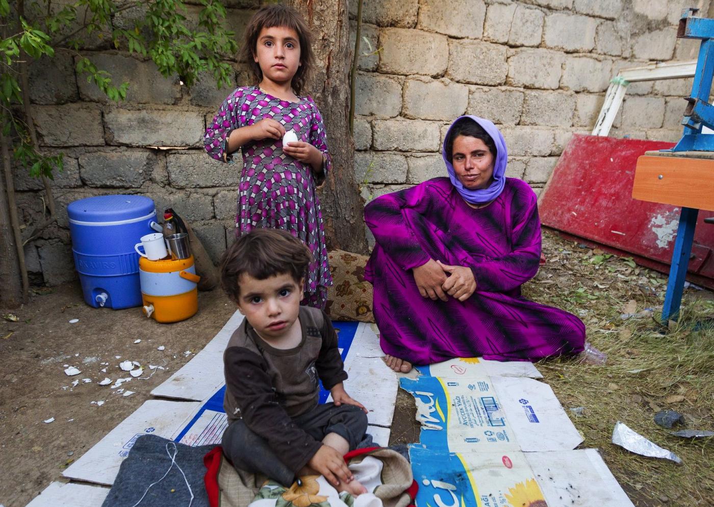 A displaced family sets up a camp on the front yard of a school in Northern Iraq. © WCC/Gregg Brekke