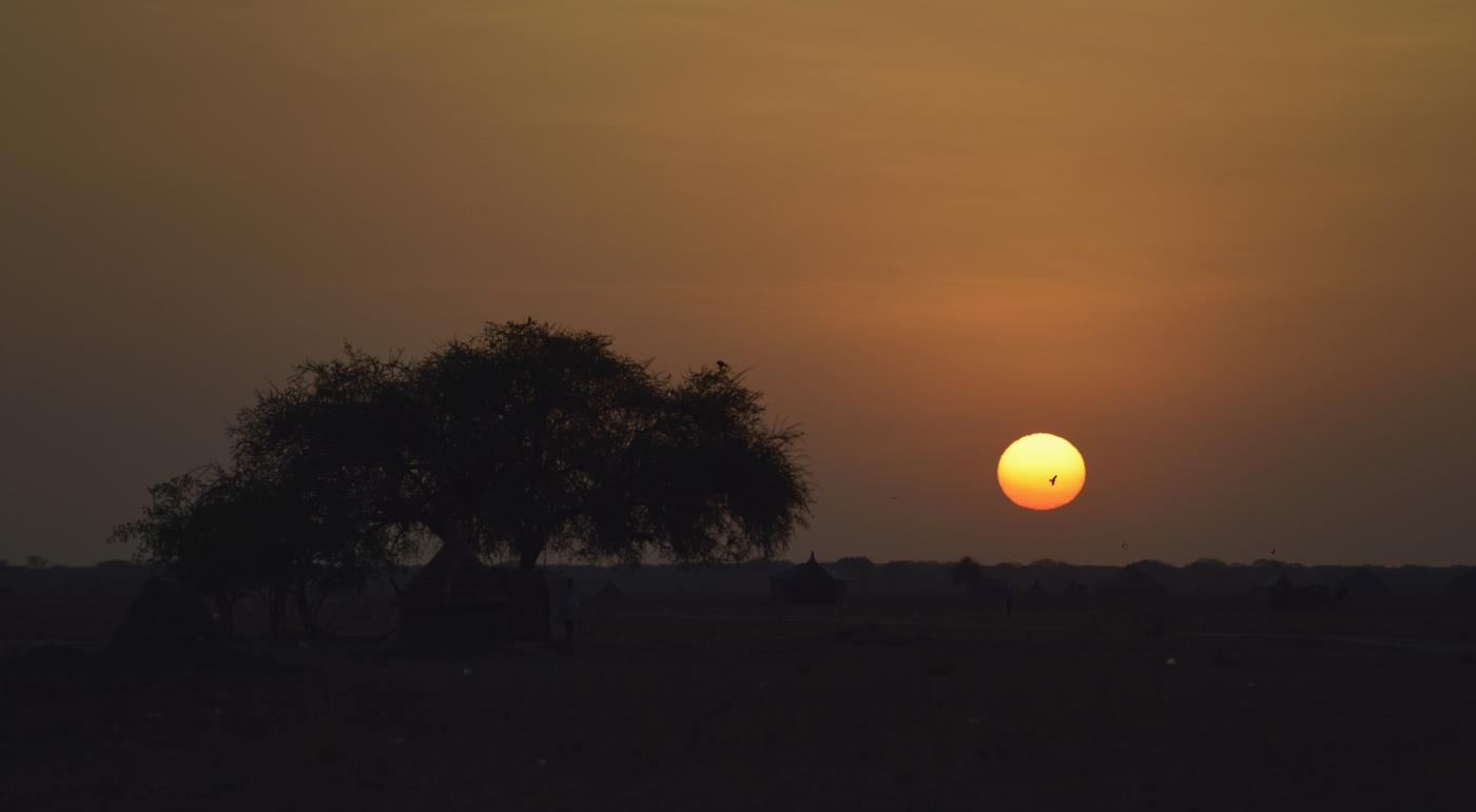 Sunrise in Dong Boma, a Dinka village in South Sudan's Jonglei State. Photo: Paul Jeffrey/ACT, 2017