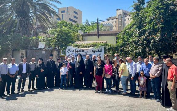Christian delegation poses for a group photo while visiting the neighbourhood of Sheikh Jarrah