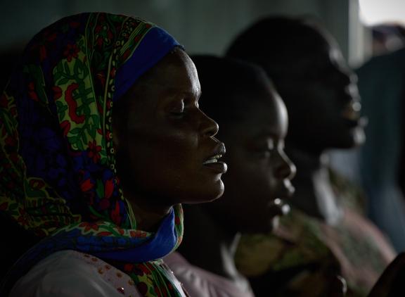 African women in prayer. 