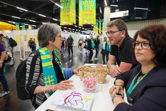 Visitors at the WCC booth in Kirchentag