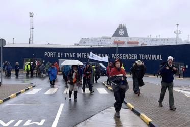 Climate pilgrims leave the ferry terminal in Newcastle.
