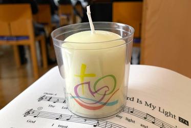 A candle with the symbol of the WCC 11th Assembly