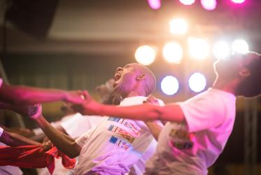 young people dance on the stage during one of the 2018 Mission Conference plenary, in Arusha, Tanzania