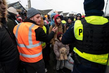 people standing at the Polish-Ukrainian border crossing Medyka