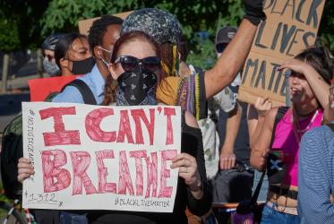 People hold signs at a June 3, 2020, Black Lives Matter protest in Eugene, Oregon. Participants were protesting the murder of George Floyd and other African-Americans by police. "I can't breathe" is a reference to some of Floyd's last words as he was choked to death by a policeman. 