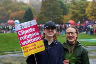 climate refugees banner at COP26