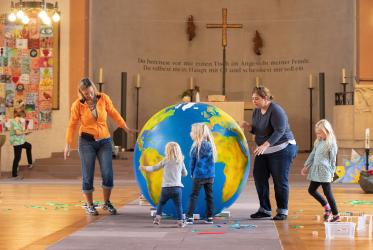 Children enjoy play time in “Domino World” at St. John's Church