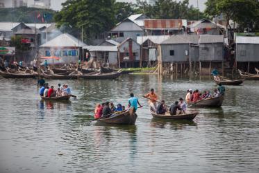 Passengers are ferried across water in Dhaka, Bangladesh.