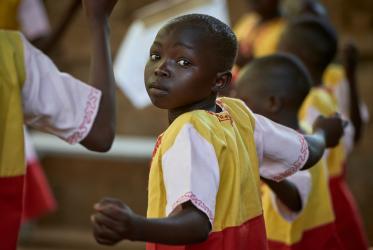 Children dance in a Mass