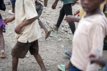 A group of children move through the reception centre of the Kalobeyei refugee settlement near Kakuma refugee camp