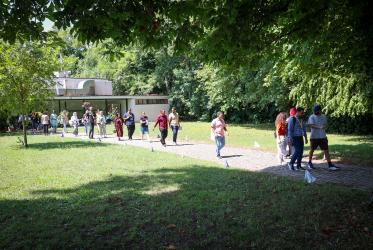Young participants of the forum walking in Bossey park