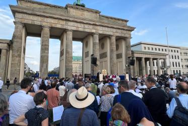Bishop addressing the gathering at the Brandenburg gate in Berlin