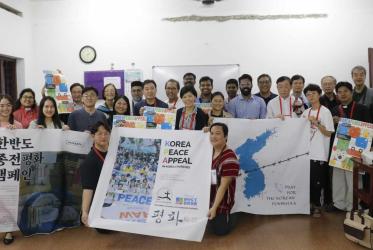 Group photo with banners for peace in Korea