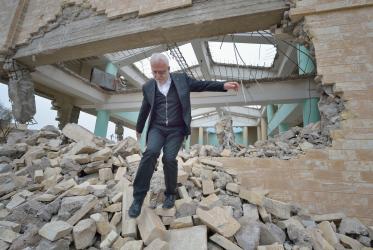 Father Emanuel Youkhana in a demolished church building in the liberated part of Mosul, Iraq. © Paul Jeffrey/WCC