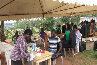 A health camp was conducted at the village chapel grounds (St Paul’s Church of Uganda Kayunga) during which people were tested for HIV in addition to other health services. Photo: Brian Muyunga
