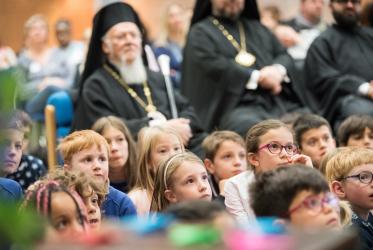 Children from the Greek schools in Geneva and Lausanne watch a puppet show together with the Ecumenical Patriarch on 2018 World Children’s Day. Photo: Albin Hillert/WCC