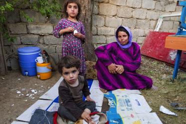 A displaced family sets up a camp on the front yard of a school in Northern Iraq. © WCC/Gregg Brekke