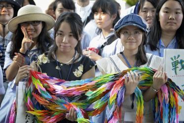 Youth from an Anglican school in Osaka, Japan, join a commemoration event in Hiroshima, bringing paper cranes as symbols of hope and peace. Photo: Paul Jeffrey/WCC